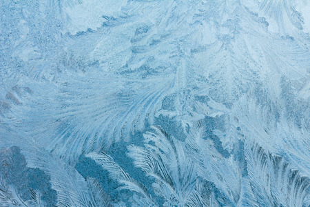 Frosty ice pattern on winter window glassの写真素材
