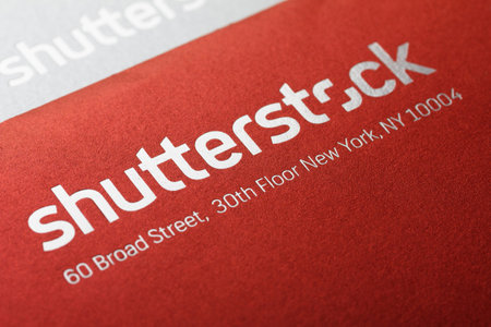 KIEV, UKRAINE - February 3: Large Shutterstock Corporation logo printed on a envelope and post card, in Kiev, Ukraine, on February 3, 2014. Shallow depth of field.のeditorial素材