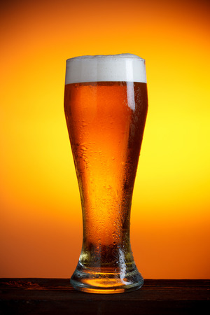 Beer glass on wooden table still lifeの写真素材