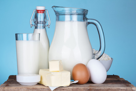 Dairy products assortment on old wooden table, blue の写真素材