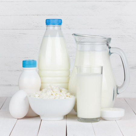 Dairy products on white wooden tableの写真素材