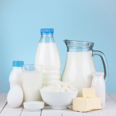 Dairy products assortment on wooden table, blue の写真素材