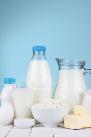 Dairy products assortment on wooden table, blue , copy spaceの写真素材