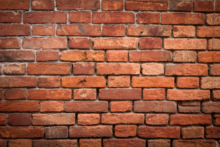 Old grunge red brick wall textureの写真素材
