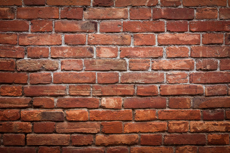 Old grunge red brick wall textureの写真素材