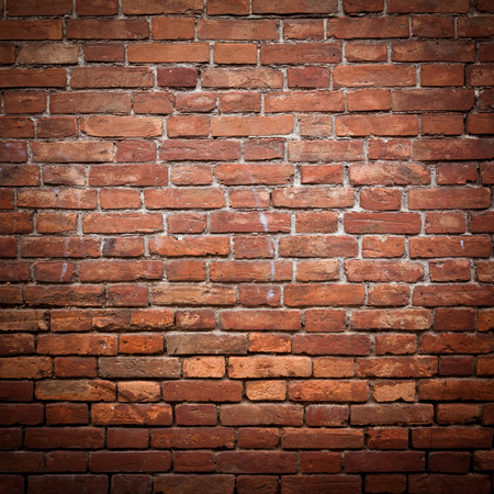 Old grunge red brick wall textureの写真素材