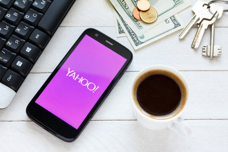 KIEV, UKRAINE - June 9: Yahoo service logo on new smartphone, in Kiev, Ukraine, on June 9, 2014.のeditorial素材