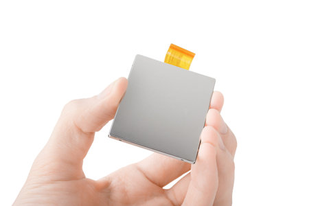 New electronics part in hand, technology innovation conceptの写真素材