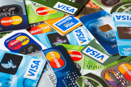 KIEV, UKRAINE - July 7: Pile of credit cards, Visa and MasterCard, credit, debit and electronic, in Kiev, Ukraine, on July 7, 2014.のeditorial素材