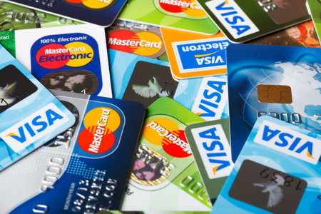 KIEV, UKRAINE - July 7: Pile of credit cards, Visa and MasterCard, credit, debit and electronic, in Kiev, Ukraine, on July 7, 2014.のeditorial素材