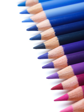 Color pencils in a row, isolated on whiteの写真素材