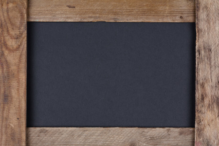 Blank black chalkboard in old wooden frameの写真素材