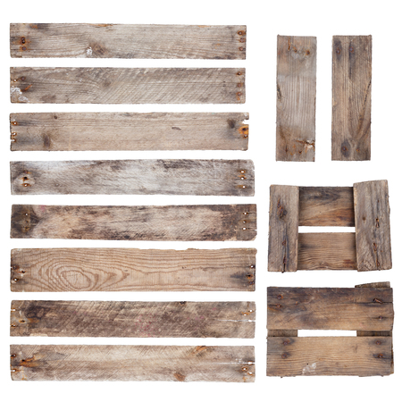 Weathered old wooden planks with rustic nails isolated on white backgroundの写真素材