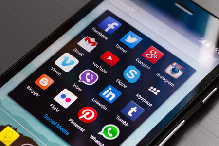 KIEV, UKRAINE - August 25: Different popular social media icons in a group folder on android smartphone homescreen, in Kiev, Ukraine, on August 25, 2014.のeditorial素材