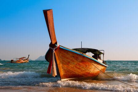 Traditional longtail wooden boat at Andaman seaの写真素材