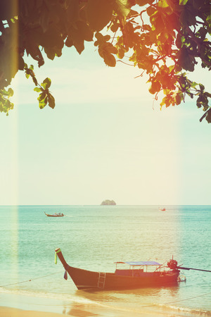 Traditional longtail boat, vintage toned and stylizedの写真素材