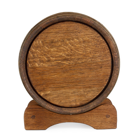 Old wooden barrel on rack back view isolated on whiteの写真素材