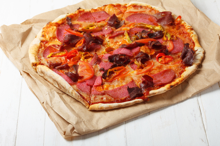 Piiza with ham and salamiの写真素材