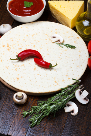 Cooking pizza with fresh ingredientsの写真素材