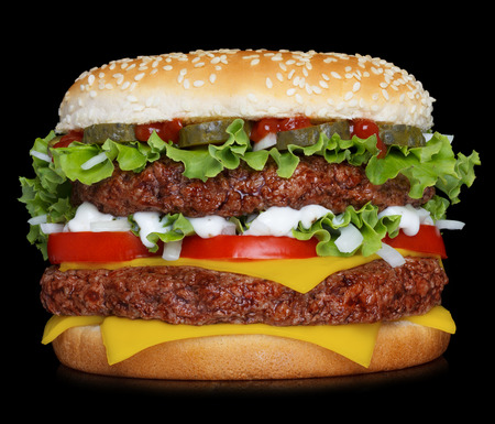 Big hamburger isolated on black backgroundの写真素材