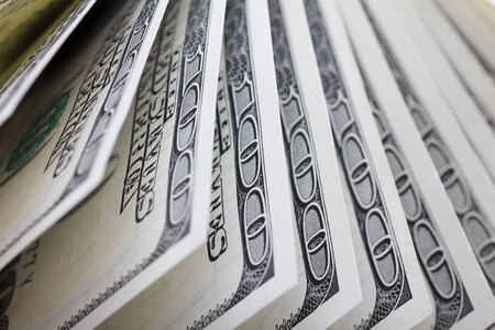 Hundred dollar bills in a row, shallow depth of fieldの写真素材