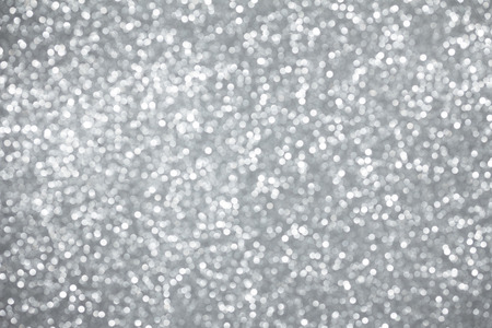 Silver lights bokeh background, abstract defocused glowing circlesの写真素材