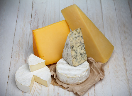 Cheese variety on wooden table still lifeの写真素材