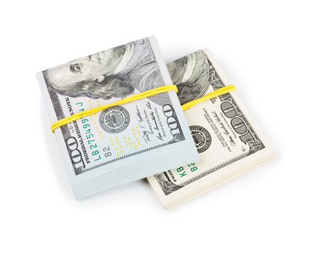 Hundred Dollar bills folded and tied with rubber band isolatedの写真素材