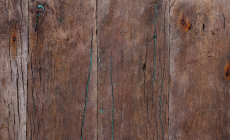 Dark weathered wooden background with rusty nailsの写真素材