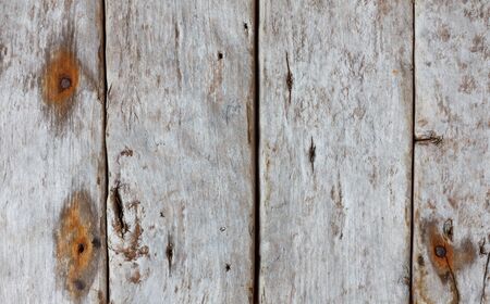 Weathered wooden background with rusty nailsの写真素材