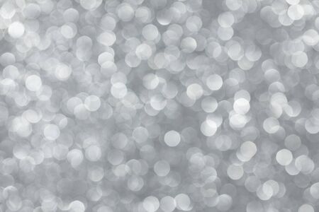 Silver bokeh lights abstract backgroundの写真素材
