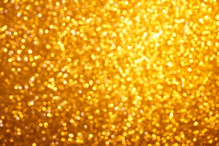Small warm bright golden lights bokeh backgroundの写真素材