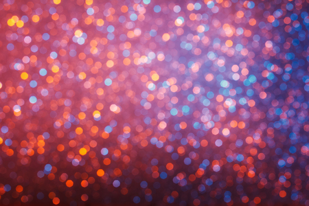 Bright different color glowing lights bokeh backgroundの写真素材