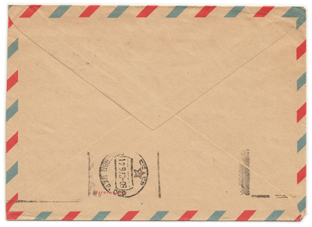 Old paper envelope with meter stamp on rear side and one side cut off. Russian inscription: "Manufactured"の写真素材