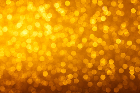 Warm glowing bright golden lights bokeh backgroundの写真素材