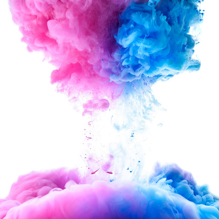 Pink and clue paint clouds in water on white backgroundの写真素材