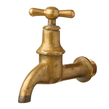 Vintage old brass water tap isolated on whiteの写真素材