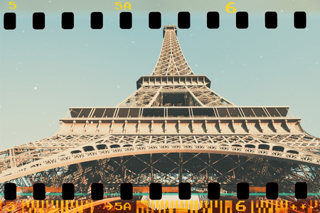 Eiffel Tower in Paris, old film stripe stylized with white paper scratchesの写真素材