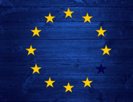 European Union flag with glowing stars and one star removed, concept of Brexit as Britain vote to leaveの写真素材