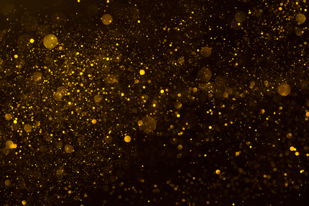 Golden stardust flow glitter shiny abstract backgroundの写真素材