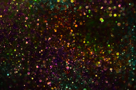 Multicolored vibrant glitter dust backgroundの写真素材