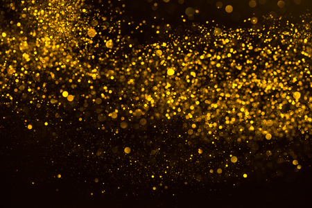 Gold confetti dust rain abstract backgroundの写真素材