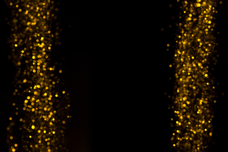 Golden bokeh lights background with copy spaceの写真素材