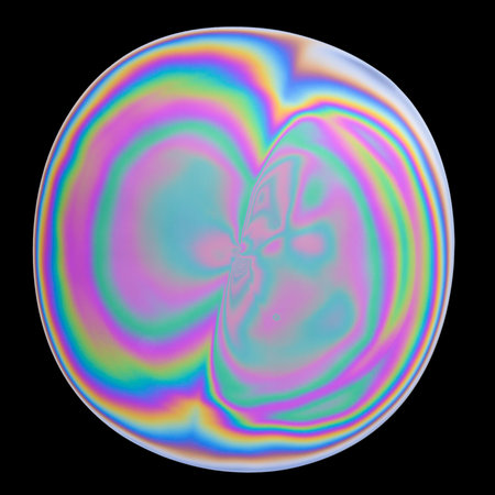Photo of abstract colorful iridescent oil circle isolated on blackの写真素材
