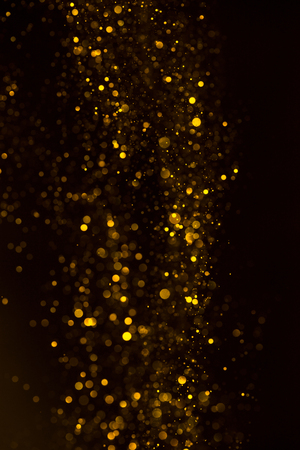 Yellow glitter shiny abstract lights flow backgroundの写真素材