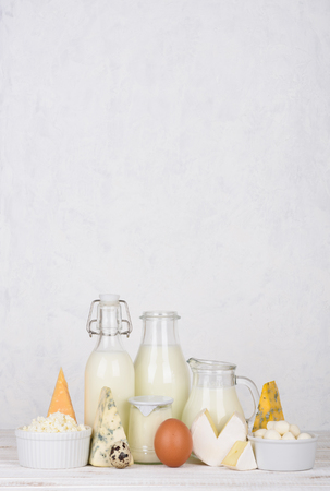 Dairy products on white wooden table vertical composition with copy spaceの写真素材