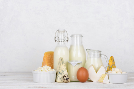 Dairy products on white wooden table with side copy spaceの写真素材