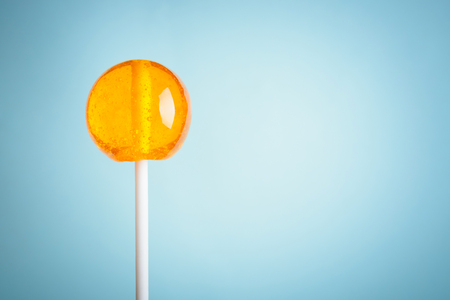 Lollipop on blue pastel backgroundの写真素材