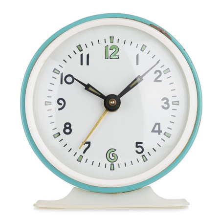 Vintage alarm clock analog in green metal round case isolated on whiteの写真素材