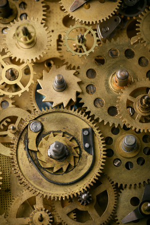 Gears and cogs in old vintage retro mechanism macro closeupの写真素材